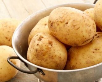 Preparing the potatos for Dum Aloo